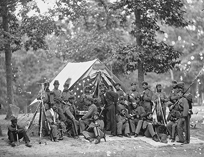 Period photo of a group of Civil War Soldiers outside a tent